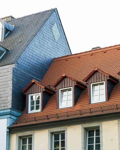 roofs-of-old-houses-with-roof-windows-and-orange-roof-tiles-in-german-city.jpg
